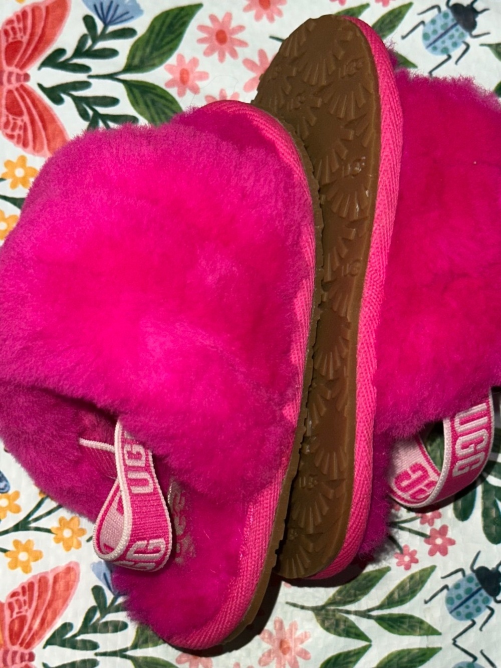 bright pink UGG Kids Fluff Yeah Slide slippers featuring soft sheepskin straps a